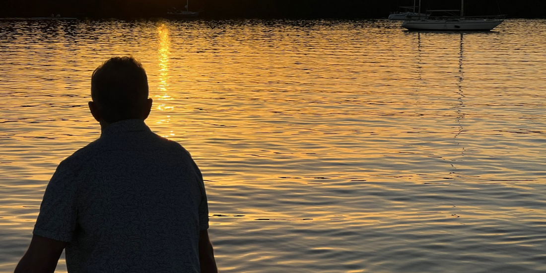 man looking out to ocean wearing Ecoalition bracelet